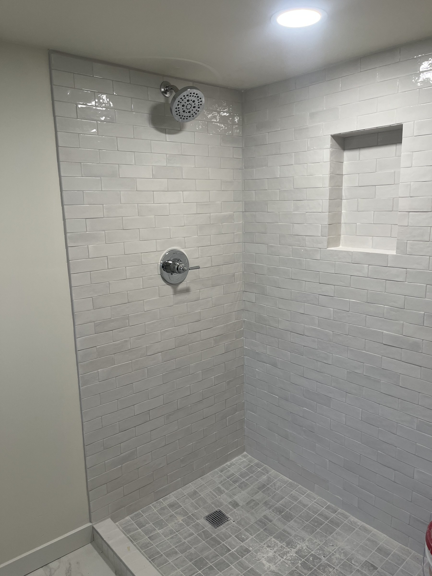 Tiled walk-in shower installation